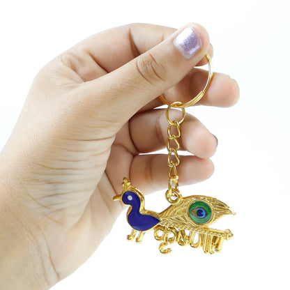Golden Krishna peacock design keychain from Wukusy featuring intricate peacock artwork on a small decorative keychain.