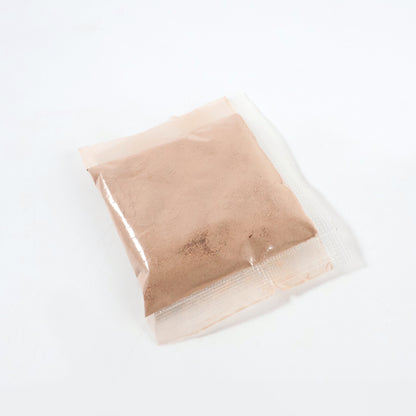 Natural orange peel powder for face by Wukusy, 5-6g packet, close-up of vibrant orange peel powder in a small packet.