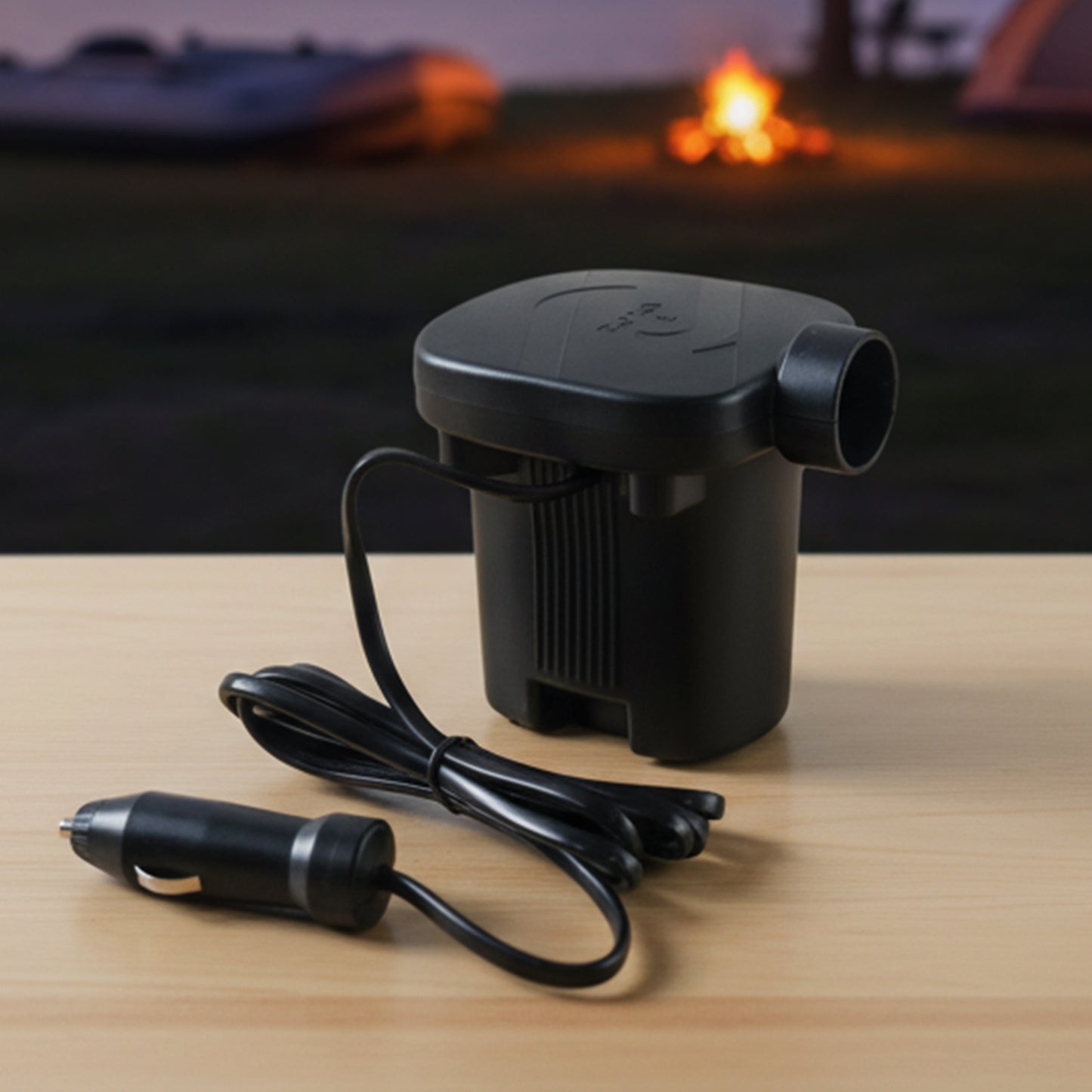 Wukusy portable electric air pump inflator set with car charging adapter, showing compact design and included nozzle attachments.