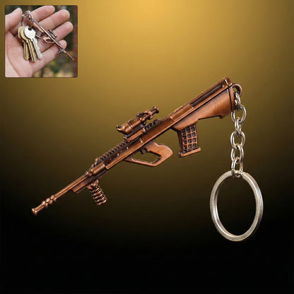 Metal gun shape keychain from Wukusy, featuring a detailed gun design attached to a keyring, for decorative and functional use.