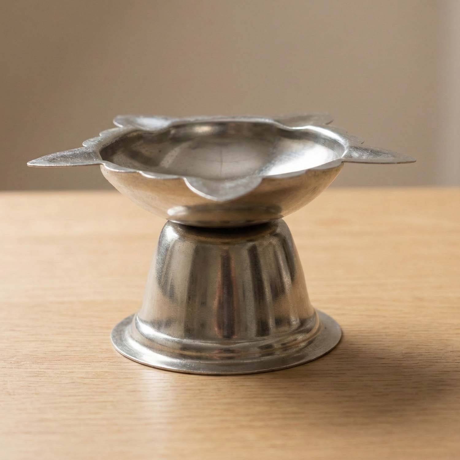 Large stainless steel sunflower design diya stand by Wukusy, decorative holder for diya lamps with detailed sunflower pattern