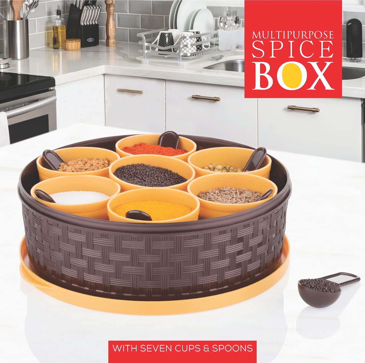Wukusy 2509 round plastic masala spice box with multiple compartments for storing spices in a kitchen.