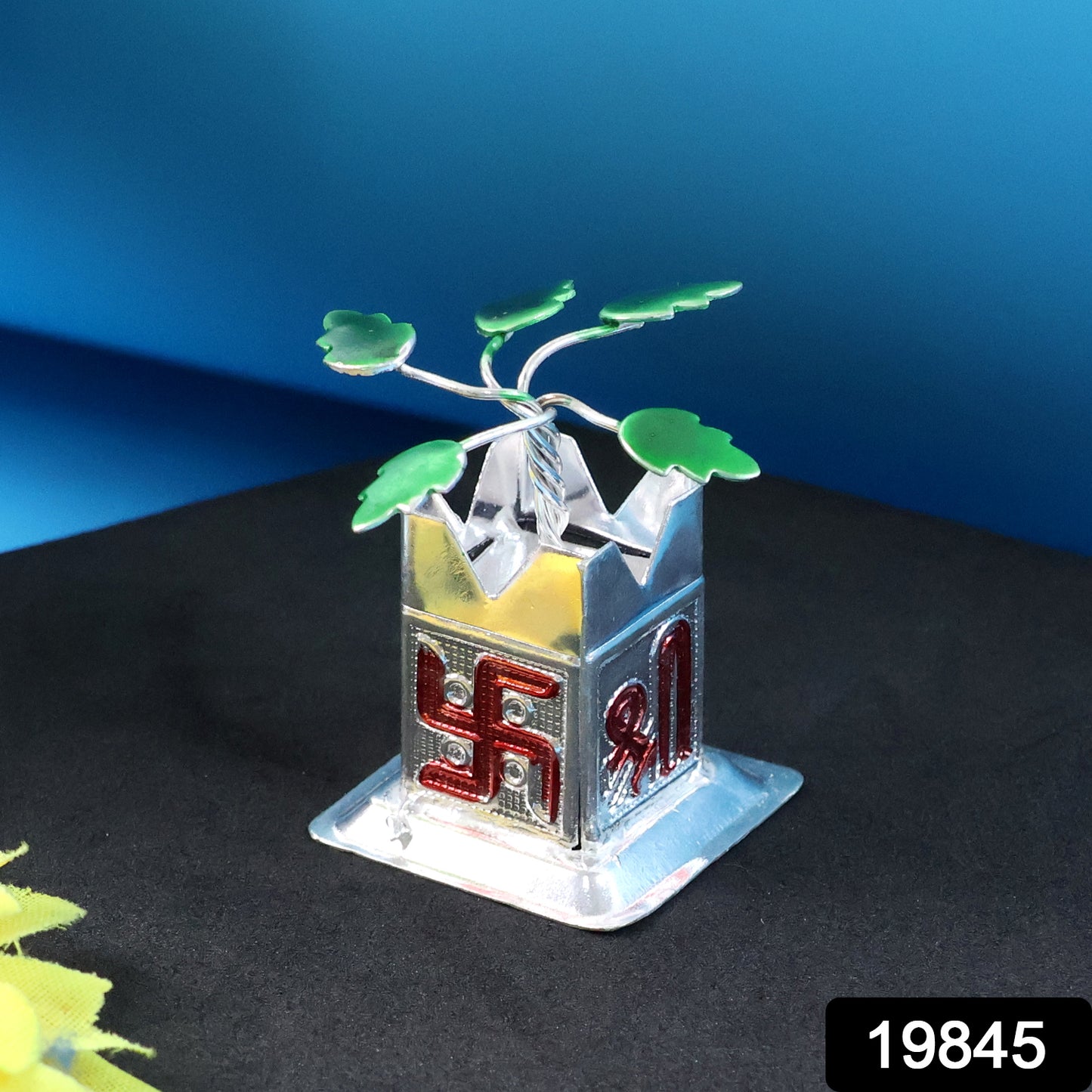 Miniature Tulsi plant idol with Mandir Kalash base, crafted for home improvement by Wukusy, displayed on a decorative stand.