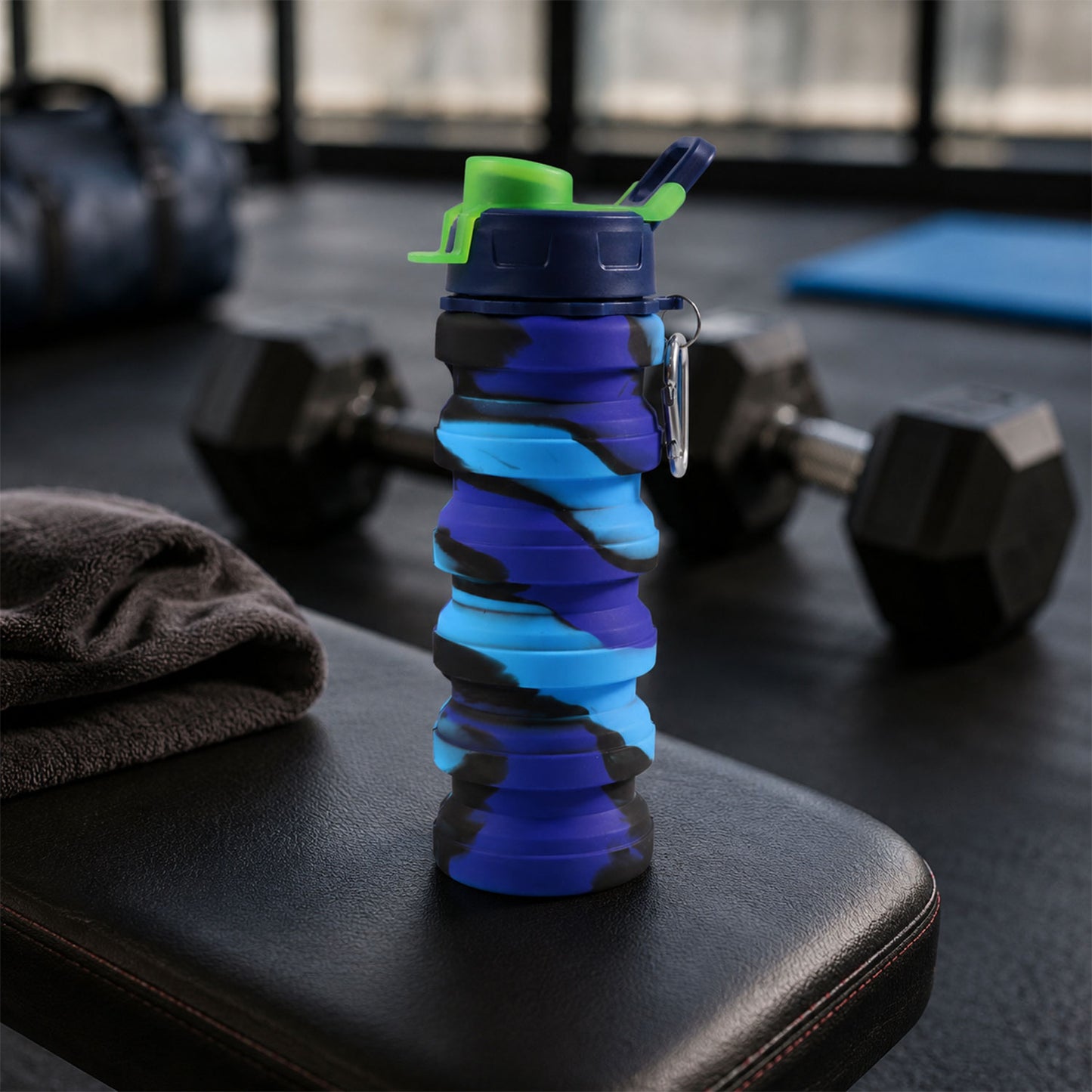 Wukusy Sili Fold collapsible silicone water bottle with leakproof design and carabiner, 500ml capacity, shown in compact form.