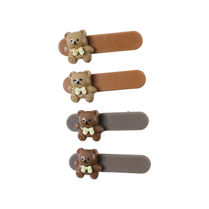 Set of four Wukusy cute teddy bear decorative hair clips for girls, featuring adorable bear designs for stylish hair accessories.