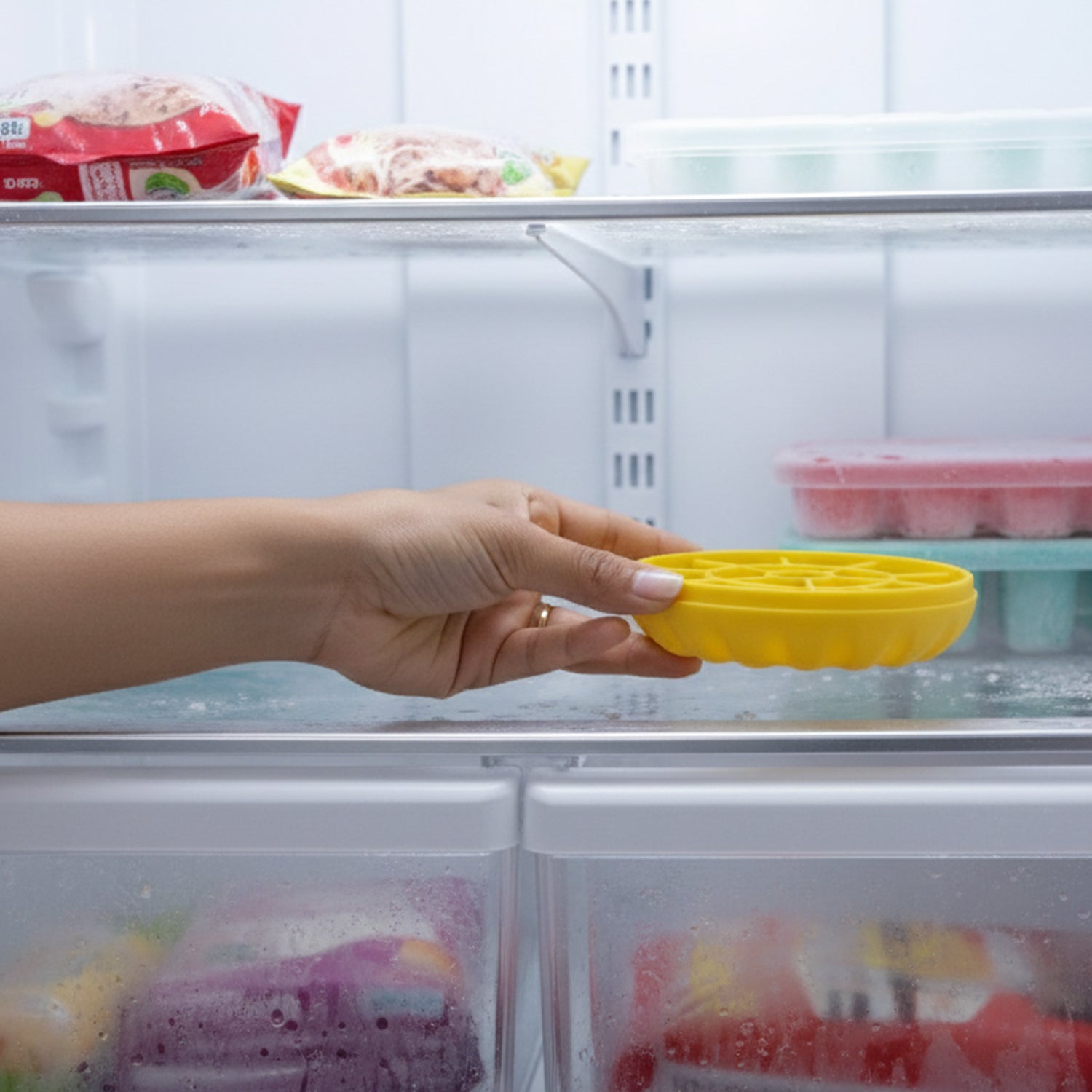 Wukusy premium round ice cube tray with lid, showing silicone mold with neatly formed ice cubes and matching lid on a kitchen counter