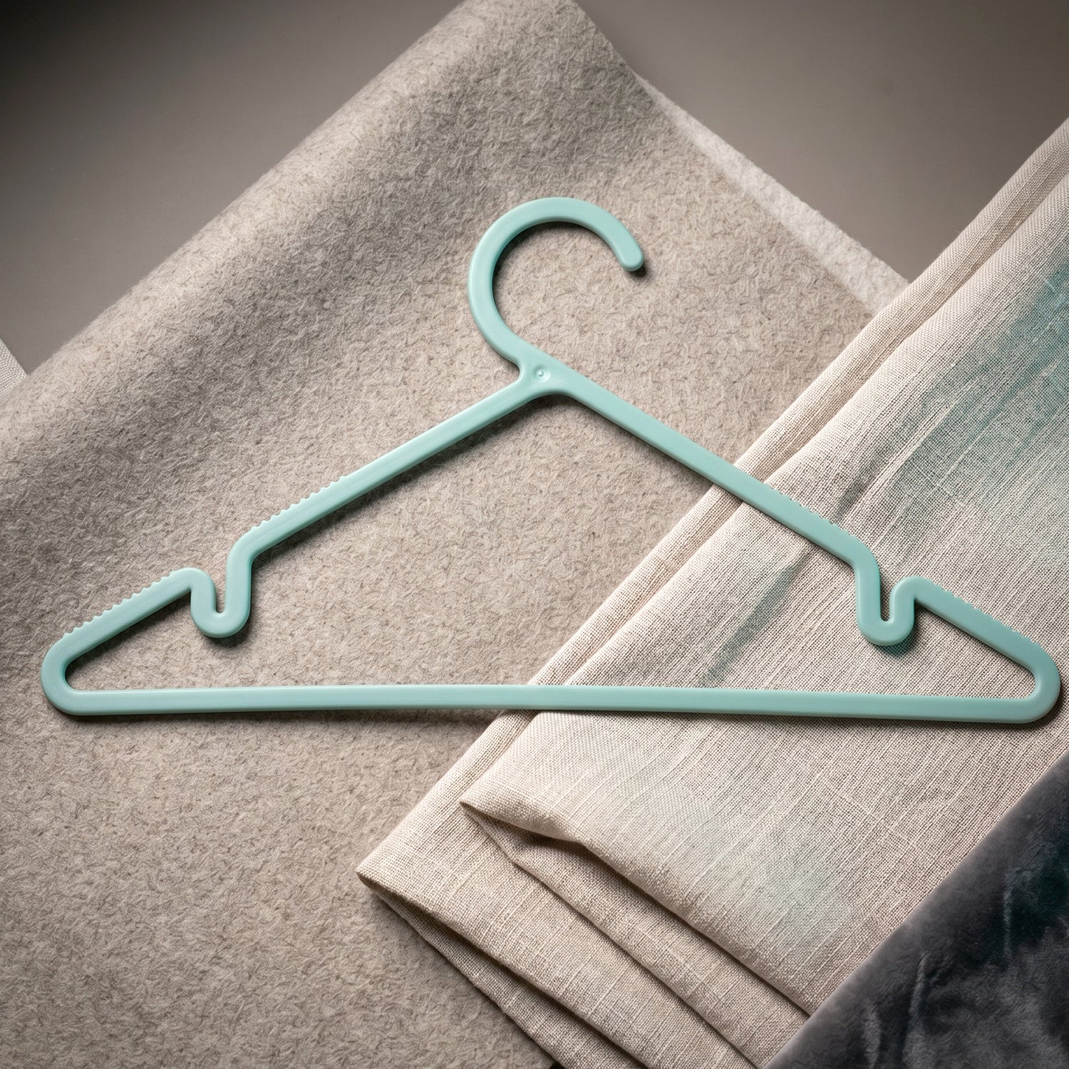 Six durable plastic clothes hangers from Wukusy Apex Gripi collection, perfect for wardrobe organization