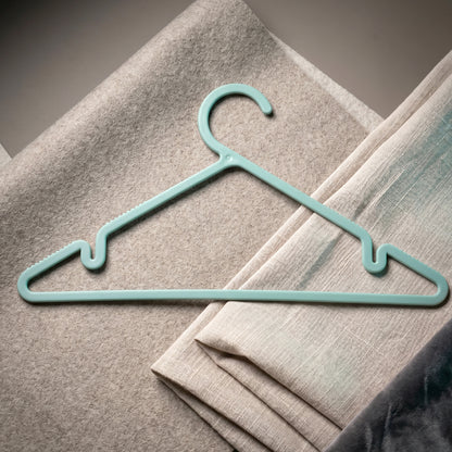 Six durable plastic clothes hangers from Wukusy Apex Gripi collection, perfect for wardrobe organization