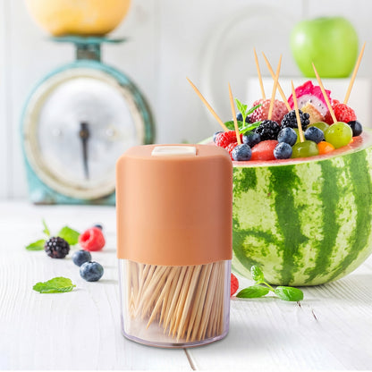 Wukusy toothpick dispenser box set with automatic pop-up holder on a dining table, showcasing sleek, modern design and easy accessibility.