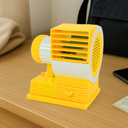 Wukusy Mini Dual-blade Portable USB table fan on office desk, compact and lightweight for personal cooling.