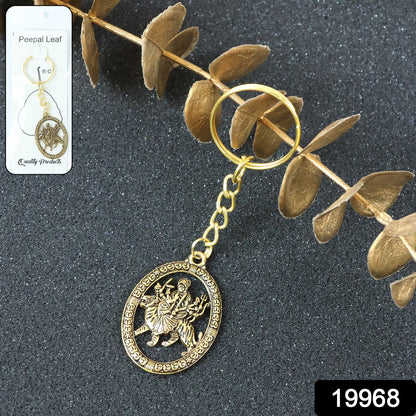 Golden Maa Durga oval frame keychain by Wukusy featuring a detailed religious image on a keyring.