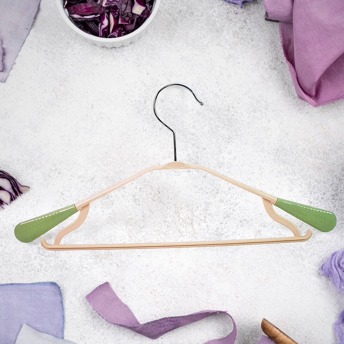 Wukusy PP cloth hanger with zinc-plated steel hook, single home improvement clothing hanger on a neutral background.