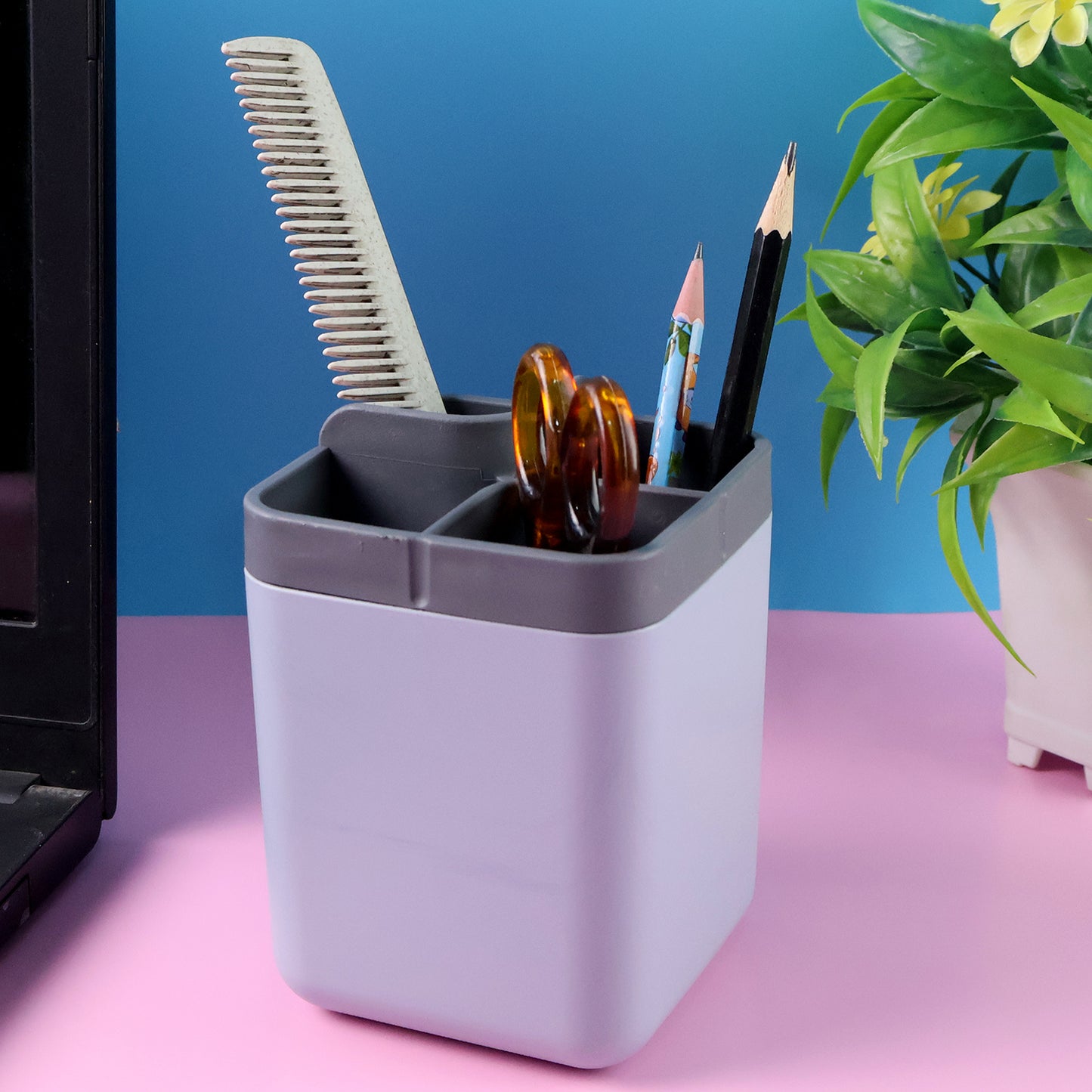Wukusy multi-compartment desk organizer utility holder showing various slots for pens, papers, and office supplies on a workspace.