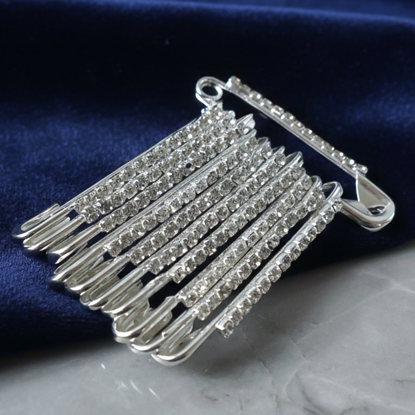 Set of 12 decorative silver finish safety pin brooches by Wukusy, featuring stylish and versatile accessory designs.