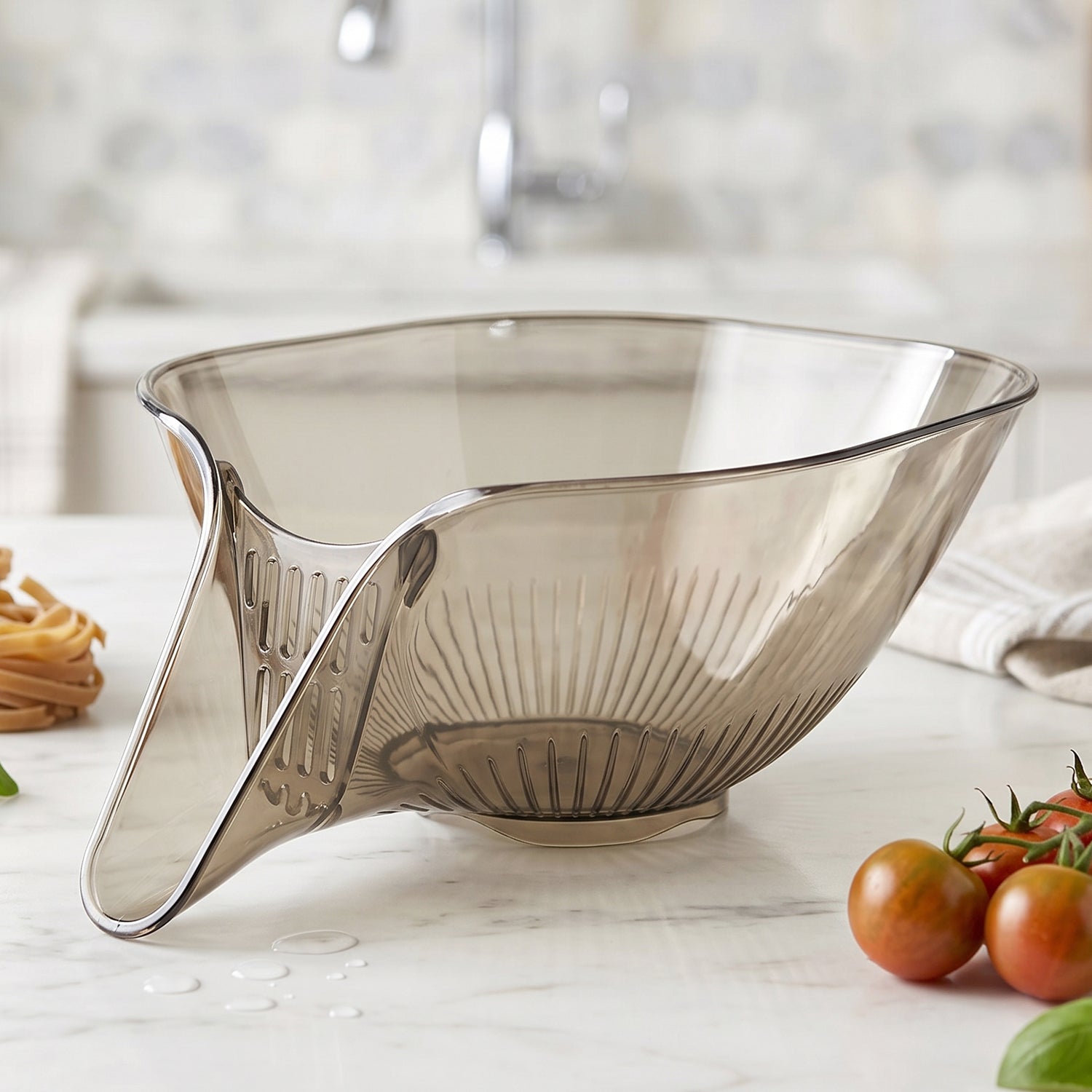 Wukusy multipurpose fruit and vegetable washing strainer basket with handle, made of durable mesh for rinsing produce.