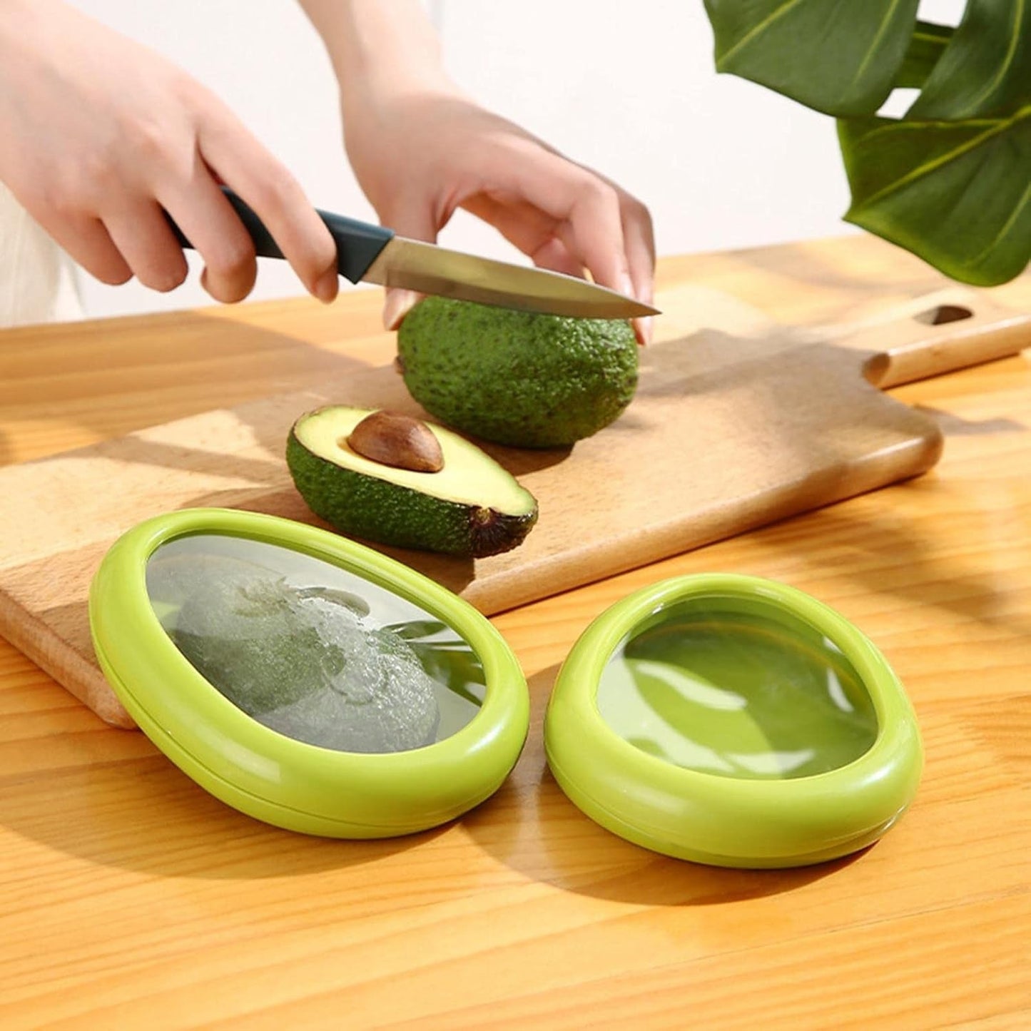 Green oval-shaped vegetable container by Wukusy, a premium fruits and vegetable saver keeper for fresh storage.