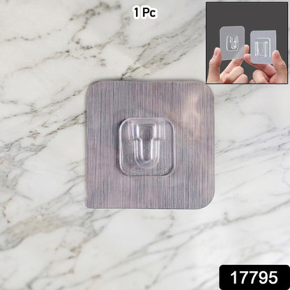 Heavy duty Wukusy self-adhesive utility wall hook mounted on a wall, sturdy and versatile for hanging tools or accessories.