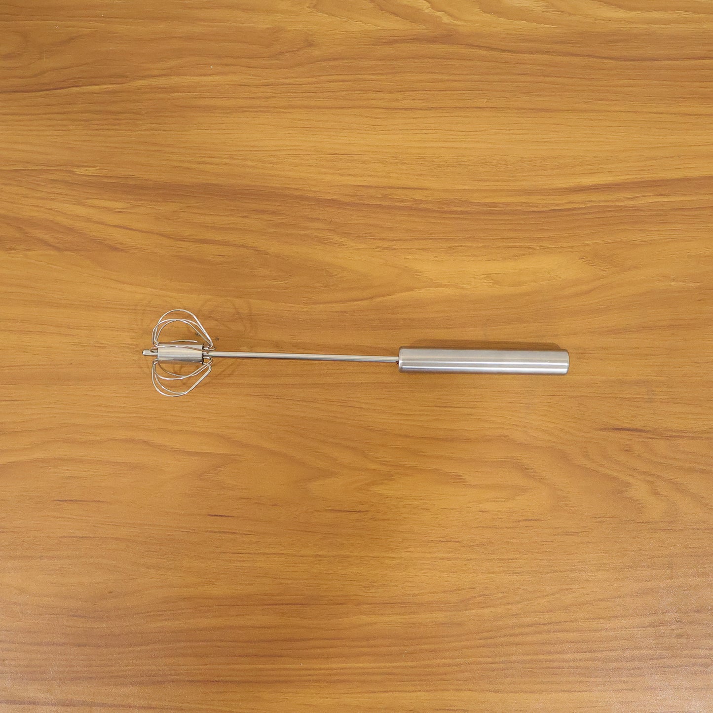 Wukusy stainless steel hand push rotary whisk, 29 cm, with a durable metal design for mixing and whipping ingredients.