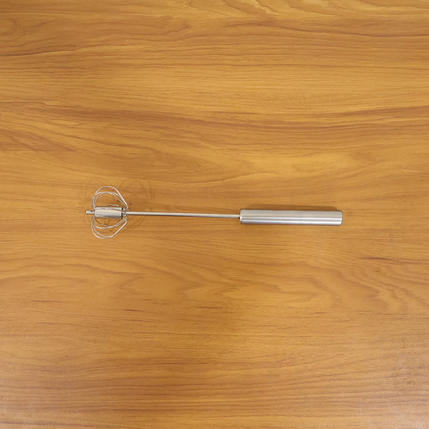 Wukusy stainless steel hand push rotary whisk, 29 cm, with a durable metal design for mixing and whipping ingredients.