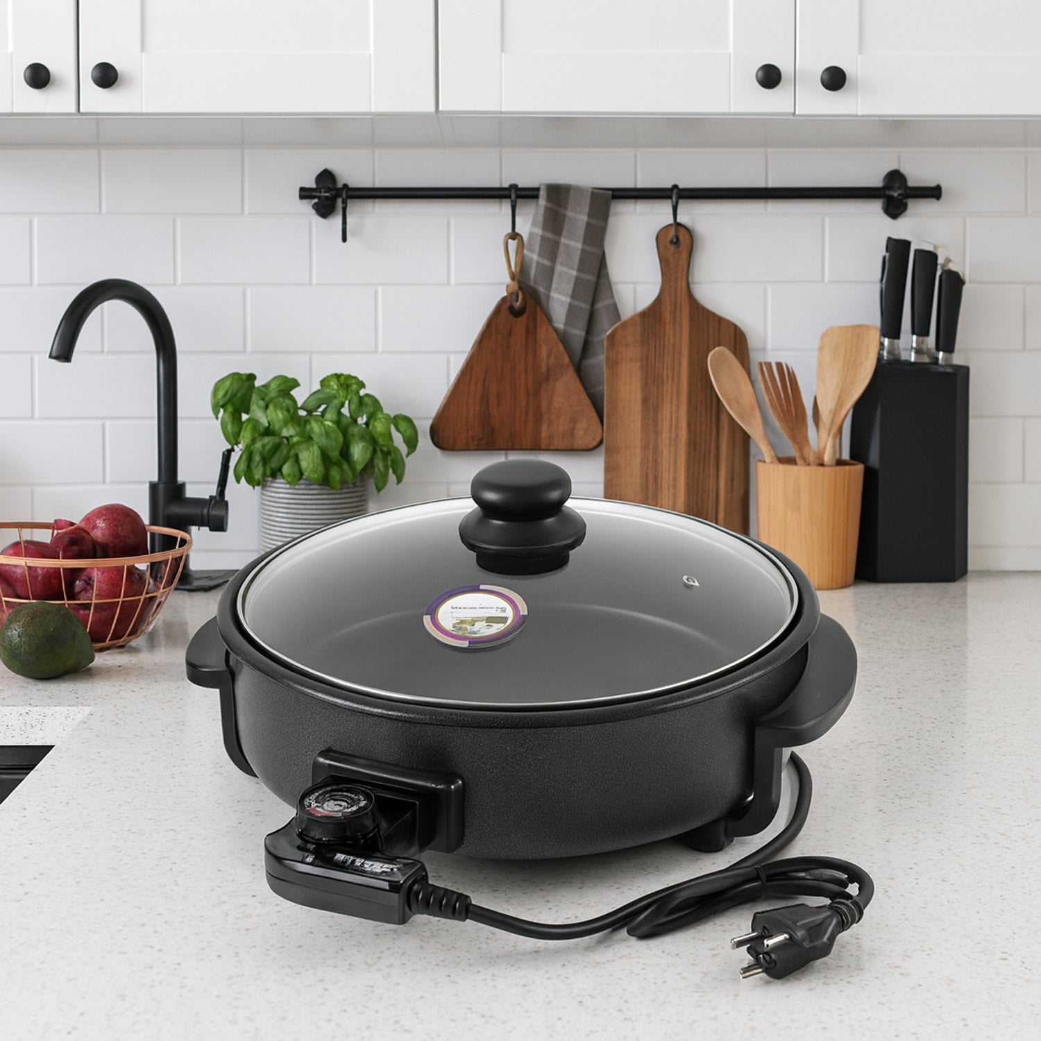 Wukusy Orbit Electric Multi-purpose Cooker 1500W with digital controls and stainless steel exterior for versatile kitchen cooking