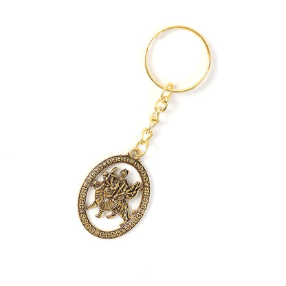 Golden metal Durga Maa keychain accessory by Wukusy featuring a detailed Durga Maa figure on a keyring.