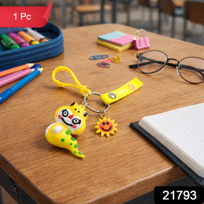 Cute cartoon dinosaur keychain with strap and decorative charm, featuring playful design and vibrant colors, by Wukusy.