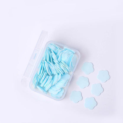 Set of 100 colorful flower-shaped mini portable travel soap paper sheets by Wukusy, compact and convenient for travel use.