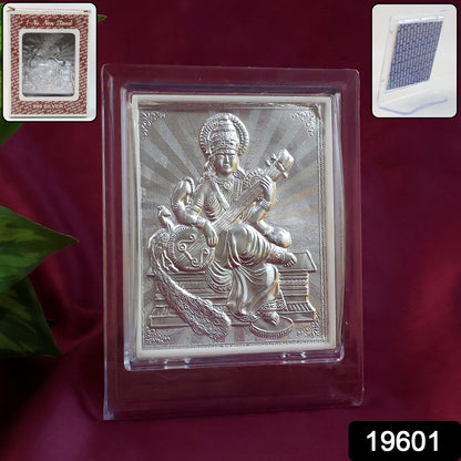 Elegant silver Saraswati Maa photo frame with stand, perfect for home decor, by Wukusy, featuring intricate design and a standing display.