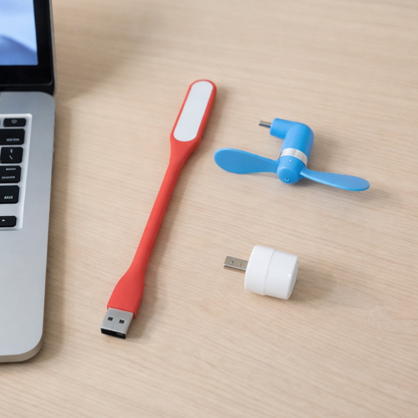 Wukusy 3-in-1 laptop accessory combo set including a portable stand, cooling pad, and keyboard cover on a clean workspace.