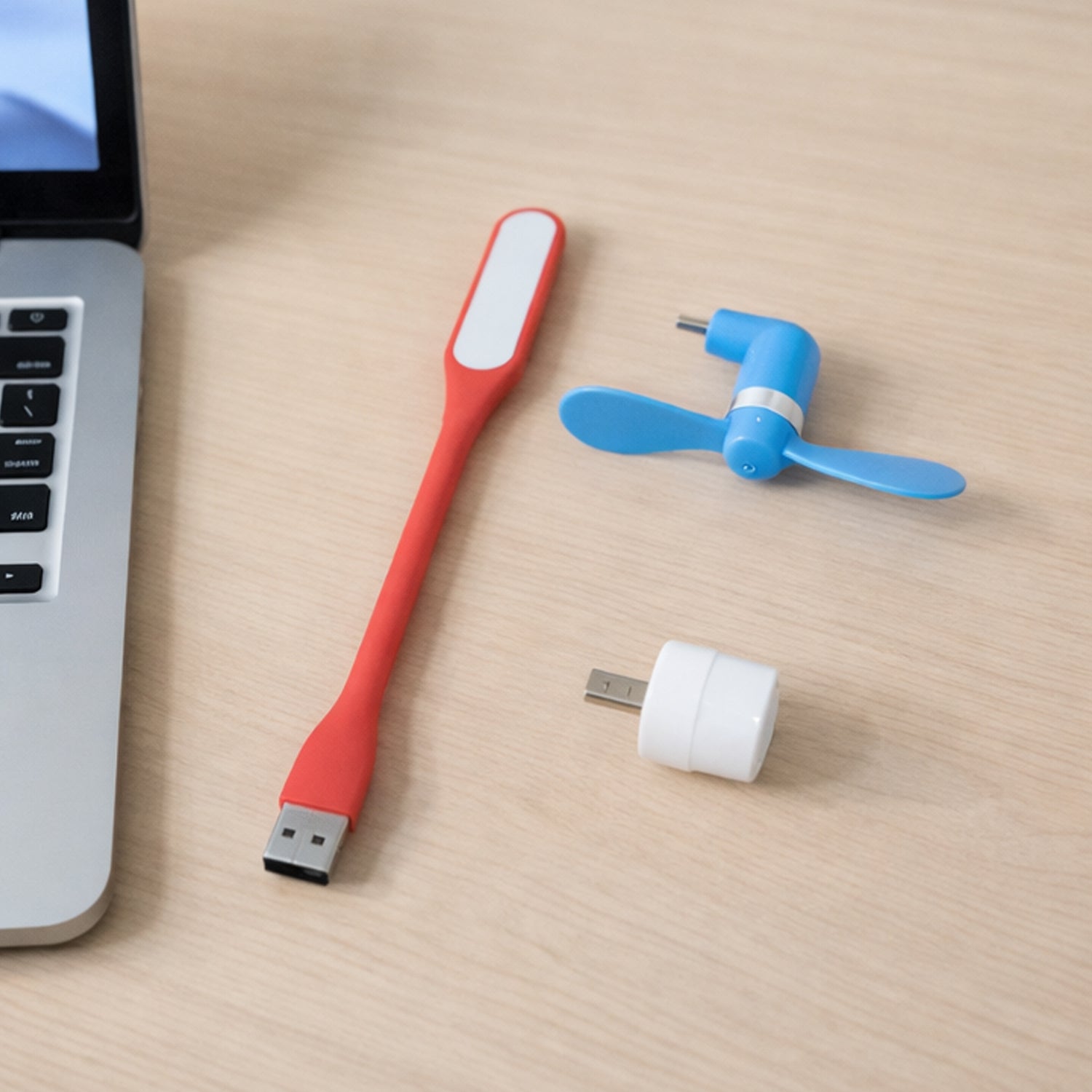 Wukusy 3-in-1 laptop accessory combo set including a portable stand, cooling pad, and keyboard cover on a clean workspace.