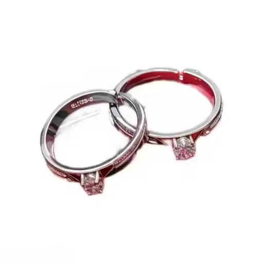 Silver-plated twin flame couple rings with American diamonds, adjustable size, showcasing intricate design and sterling silver craftsmanship.