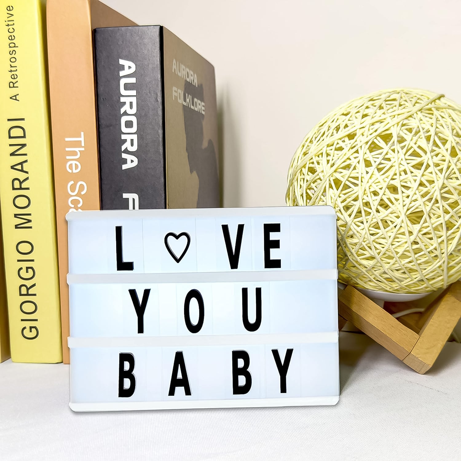 Black mini A6 magnetic cinematic light box by Wukusy with 82 character slots, 10 emojis, perfect for office decor.