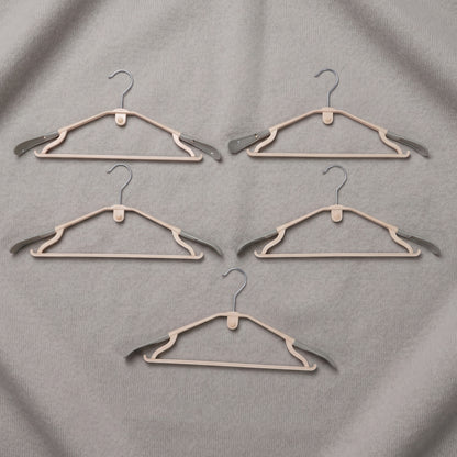 Set of five durable plastic clothes hangers from Wukusy, featuring smooth edges and sturdy design for clothing organization.