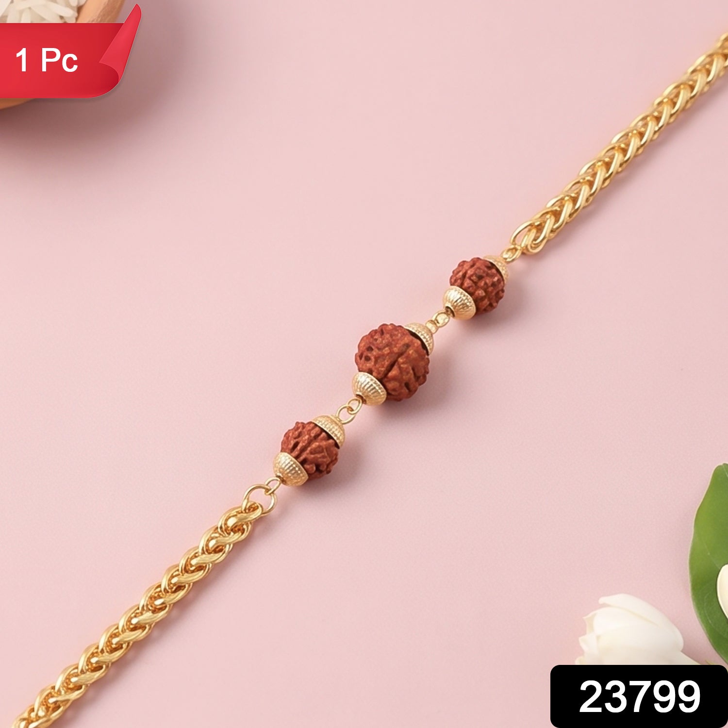 Gold-plated Rudraksha bead Rakhi on a decorative chain, designed for brothers, featuring intricate details and traditional craftsmanship.