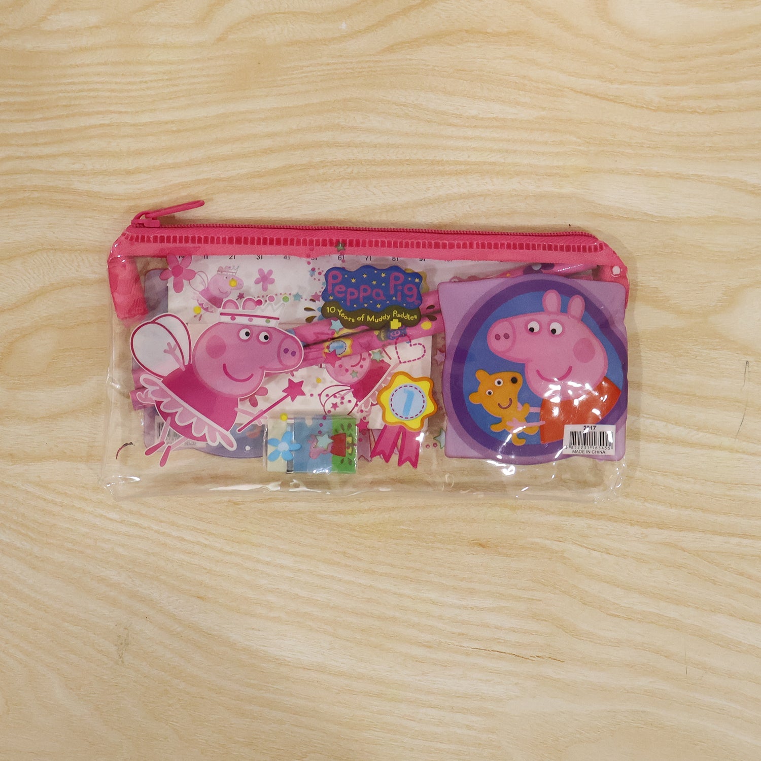 Kids school stationery kit with pencils, eraser, sharpener, ruler, and pouch from Wukusy, displayed with all included supplies visible.