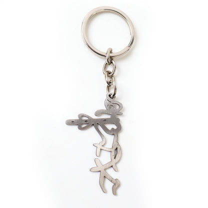 Wukusy Divine Krishna flute design metal keychain with intricate detailing and a small keyring attachment.