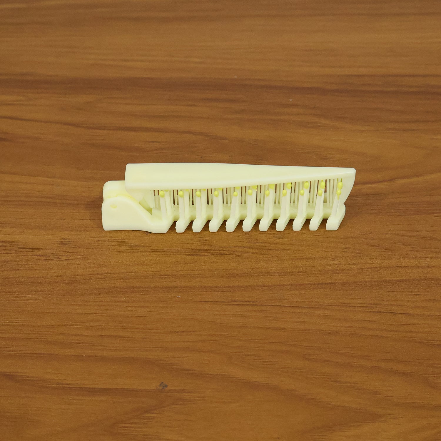 Wukusy 2-in-1 foldable hair comb with brush, compact and portable for easy hair styling and detangling.