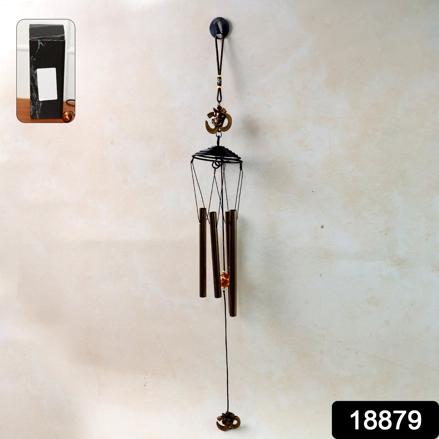 Metal wind chime with Om symbol by Wukusy, featuring hanging tubes and intricate design, outdoor decorative garden ornament
