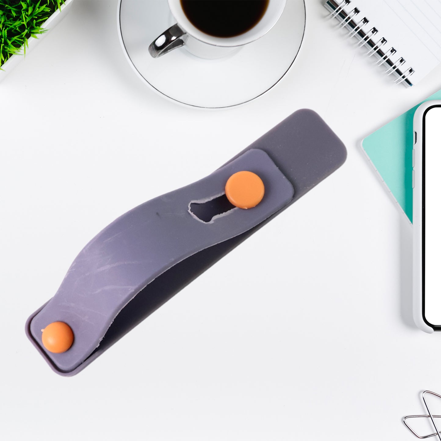 Dark grey silicone phone loop finger holder with strap, Wukusy brand, designed for secure grip on smartphones.