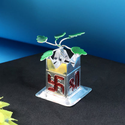 Miniature Tulsi plant idol with mandir and Kalash base, home improvement decor by Wukusy, displayed on a wooden surface.