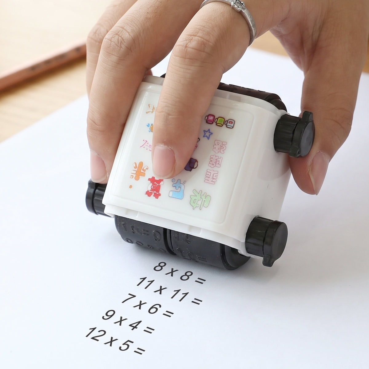 Wukusy digital teaching roller stamp for kids math practice and learning activities, showing colorful numbers and symbols.