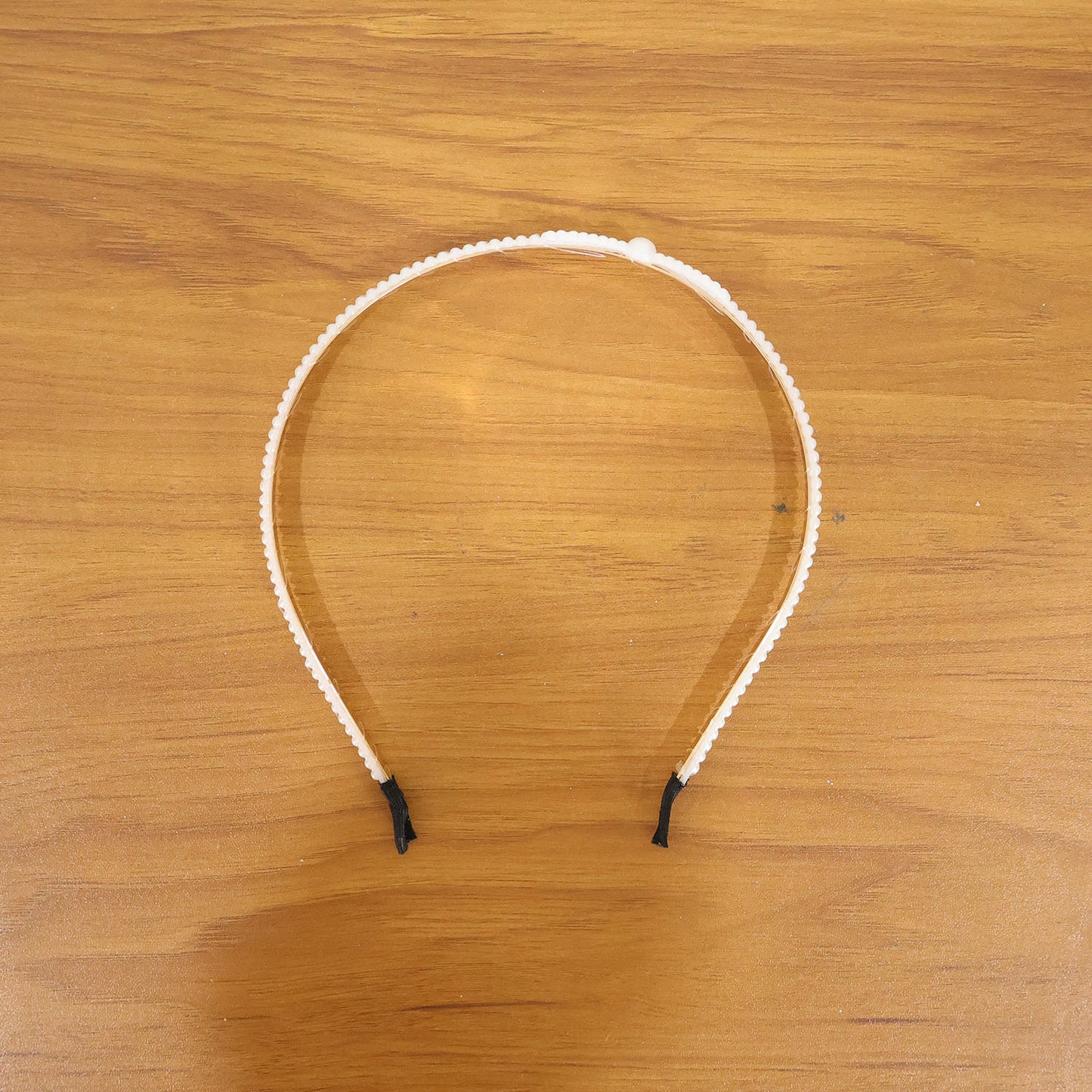 Elegant pearl beaded slim metal hair band by Wukusy showing a sleek design with pearl accents and a metal band.