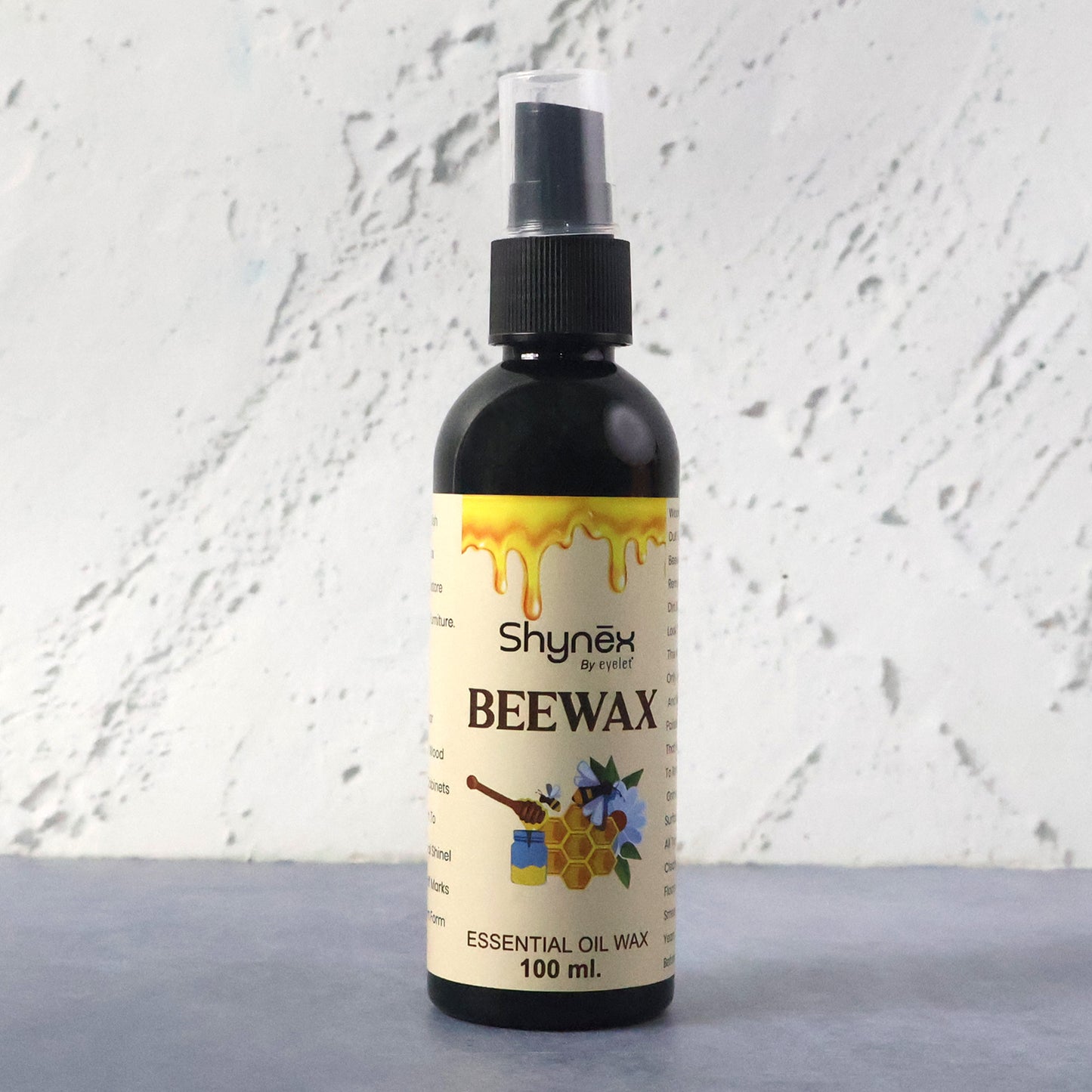 Wukusy Shynex Bee Wax Essential Oil Spray bottle with a white label and spray nozzle, ready for use.