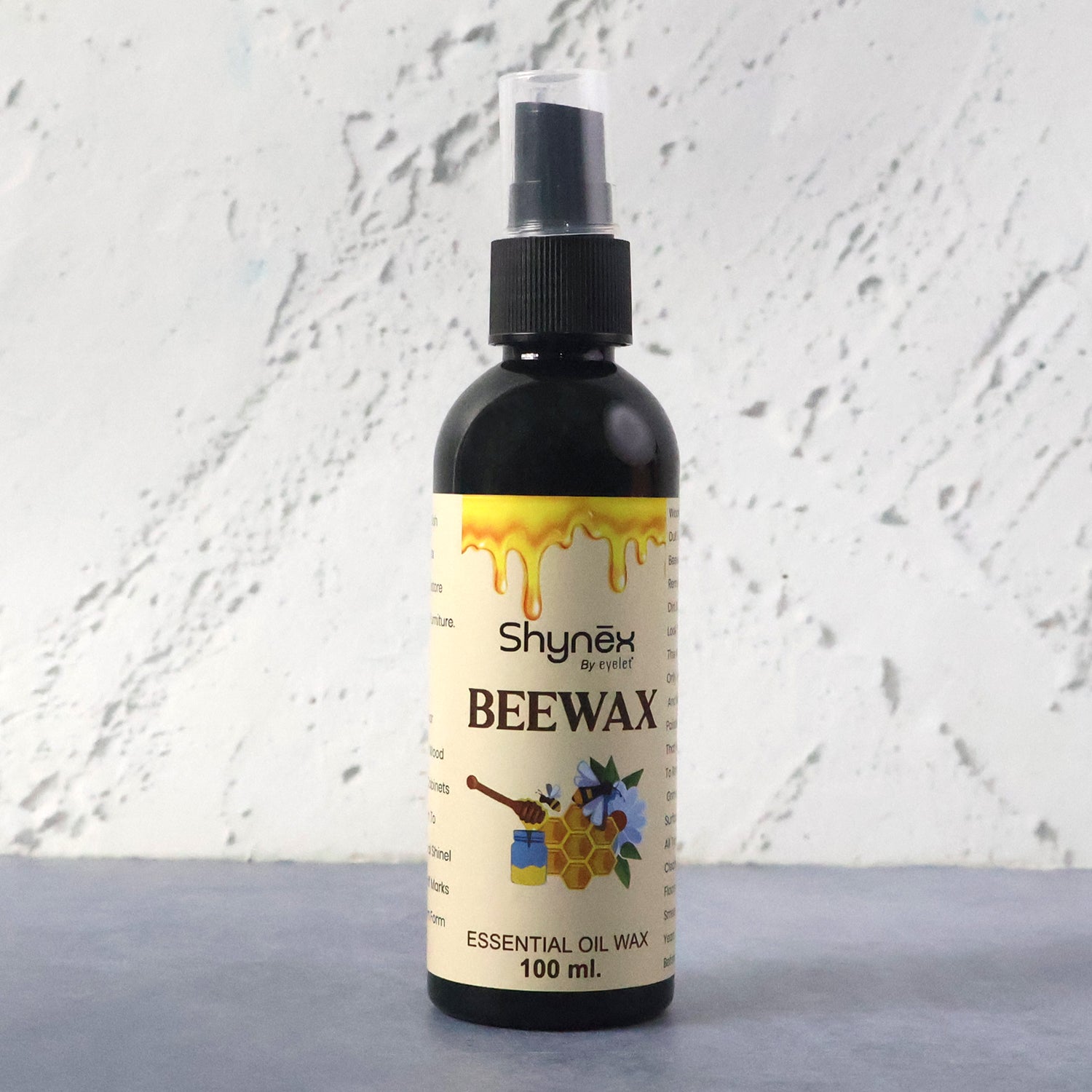 Wukusy Shynex Bee Wax Essential Oil Spray bottle with a white label and spray nozzle, ready for use.