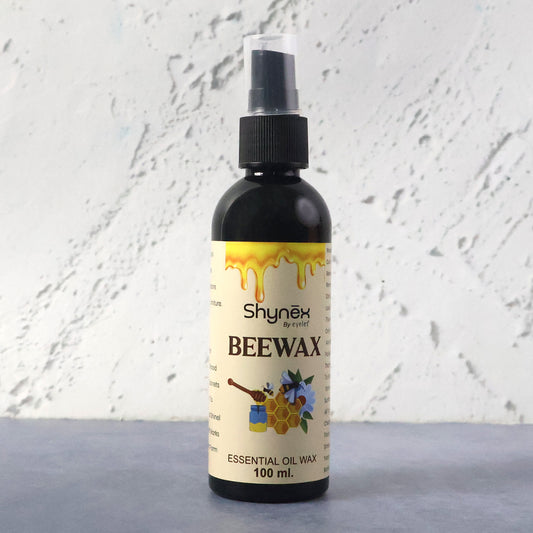 Wukusy Shynex Bee Wax Essential Oil Spray bottle with a white label and spray nozzle, ready for use.