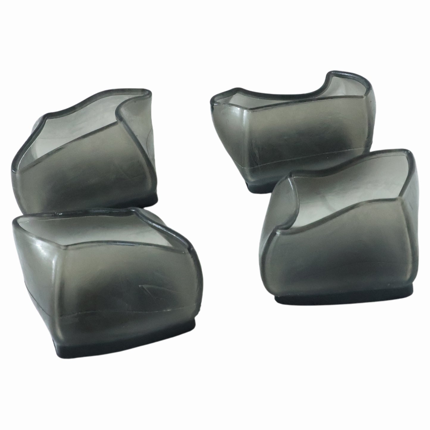 Set of four Wukusy silicone furniture leg pads and chair foot covers, protecting floors and reducing noise.
