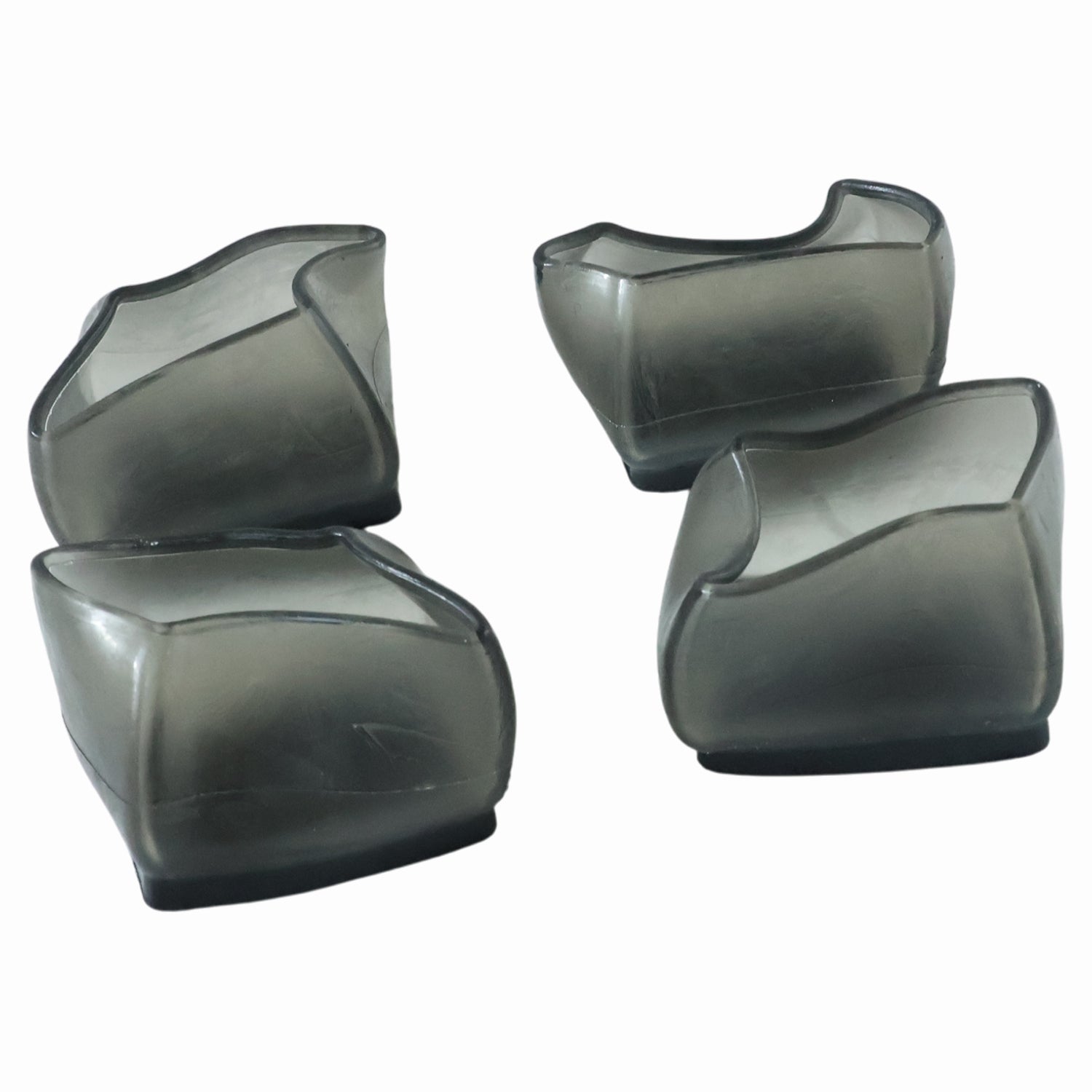Set of four Wukusy silicone furniture leg pads and chair foot covers, protecting floors and reducing noise.