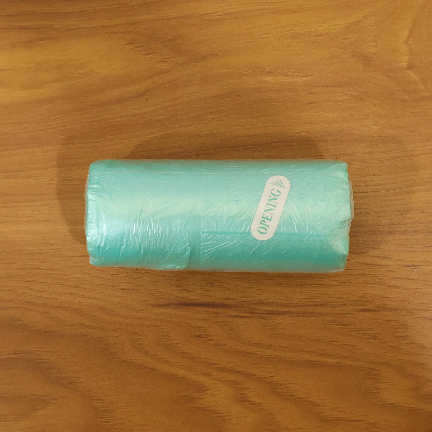 Wukusy disposable garbage bags roll with 40x45 cm size, showing clear plastic bags ready for waste disposal.