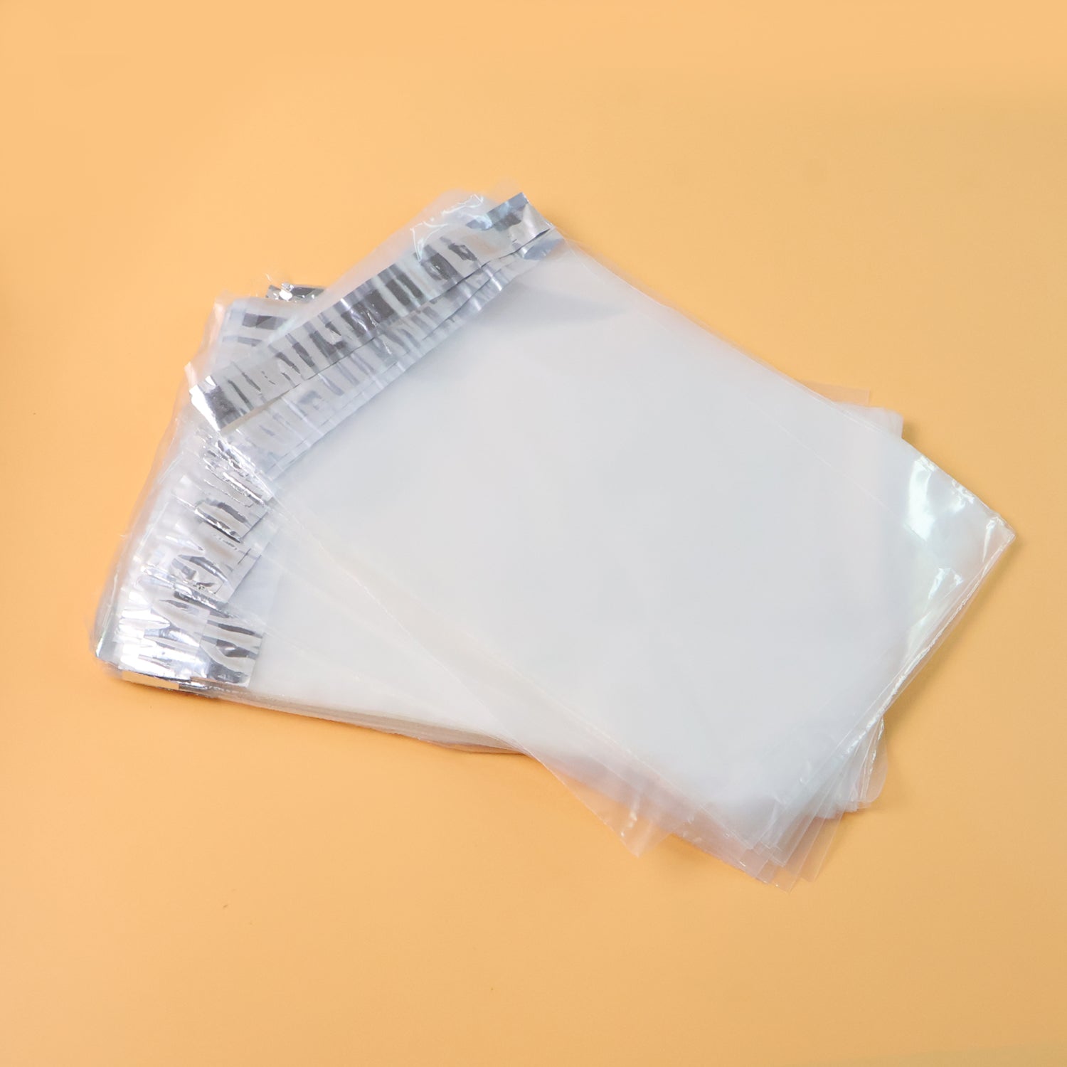 Pack of 100 clear self-adhesive courier polybags measuring 6.5x8 inches, ideal for office shipping by Wukusy