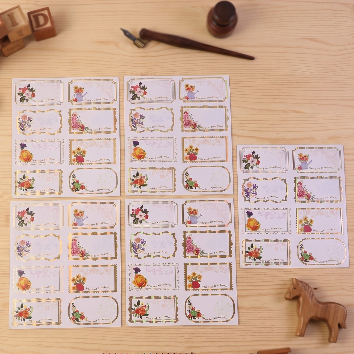 Set of 40 floral foil gift tag stickers with "Best Compliments" message from Wukusy, featuring elegant designs for gift wrapping.